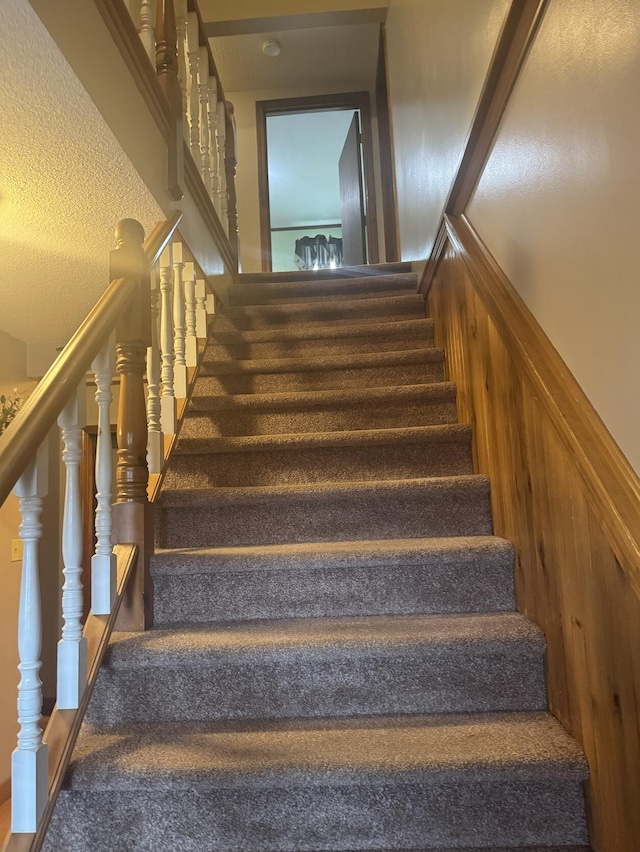 4197 Aroostook Rd, Winterville Plt, ME 04739 - staircase with a textured ceiling and carpet flooring