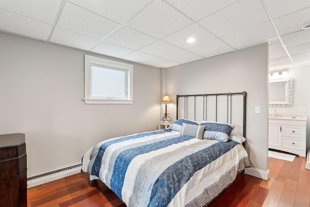 1081 Kings Hwy, Kennebunkport, ME 04046 - bedroom with a baseboard heating unit, a drop ceiling, wood finished floors, and recessed lighting