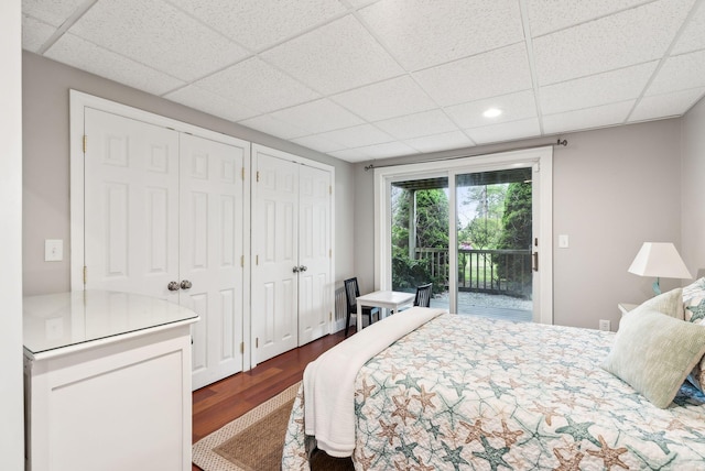 1081 Kings Hwy, Kennebunkport, ME 04046 - bedroom with access to outside, multiple closets, a paneled ceiling, dark wood-style flooring, and recessed lighting