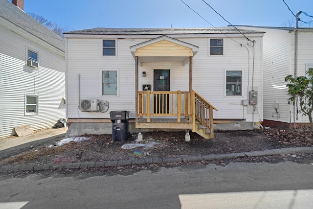 view of front of property with ac unit
