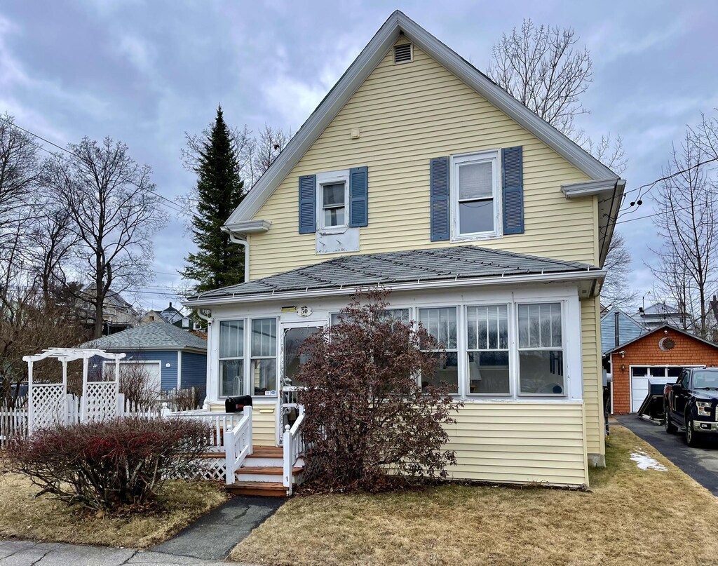 50 Congress St, Millinocket, ME 04462 - view of front of property featuring an outbuilding and a detached garage