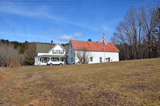 23 Park St, West Paris, ME 04289 - back of house featuring a yard and metal roof