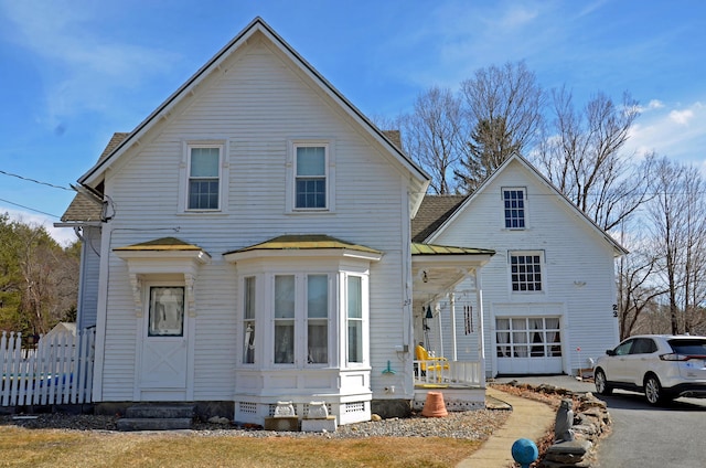 23 Park St, West Paris, ME 04289 - traditional-style house featuring metal roof, a garage, a standing seam roof, and a shingled roof