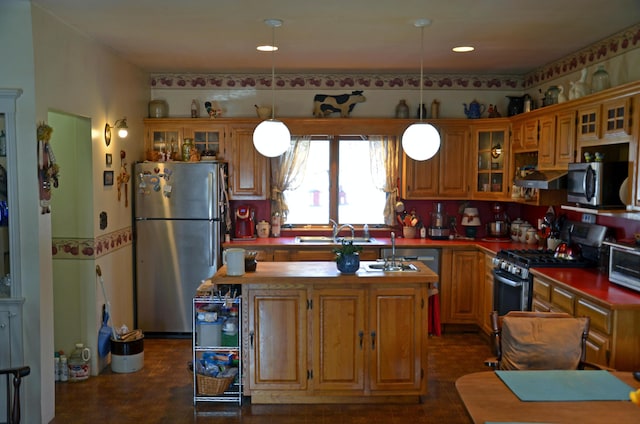23 Park St, West Paris, ME 04289 - kitchen with a sink, a kitchen island, stainless steel appliances, and glass insert cabinets