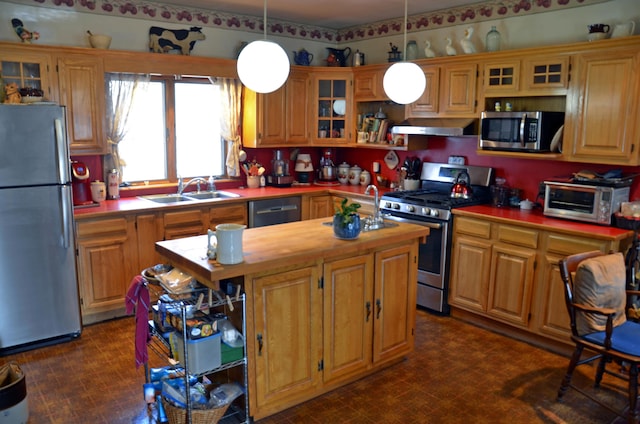 23 Park St, West Paris, ME 04289 - kitchen with ventilation hood, a sink, a kitchen island, wooden counters, and stainless steel appliances