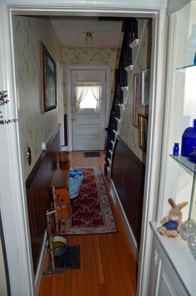23 Park St, West Paris, ME 04289 - doorway with stairs, wainscoting, visible vents, light wood-style flooring, and wallpapered walls