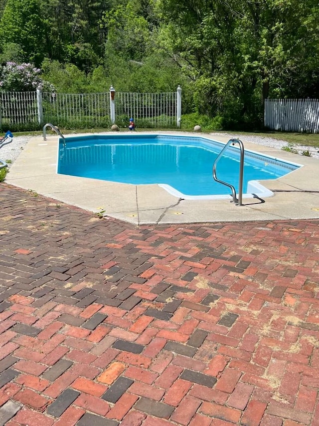 23 Park St, West Paris, ME 04289 - view of swimming pool featuring fence, a fenced in pool, and a patio area