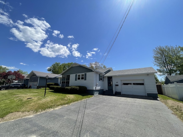 45 Vermont St, Millinocket, ME 04462 - ranch-style home with an attached garage and asphalt driveway