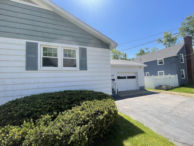 45 Vermont St, Millinocket, ME 04462 - view of home's exterior with asphalt driveway