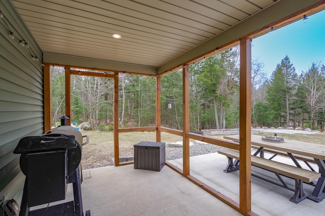 sunroom with outdoor dining space