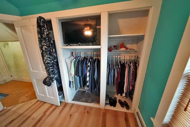closet with a baseboard heating unit