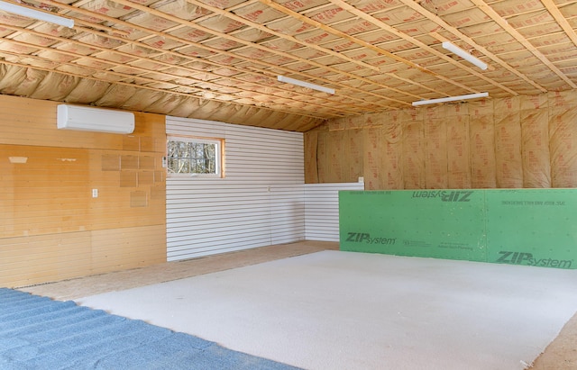interior space featuring an AC wall unit and wood walls