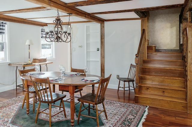 dining space featuring a wealth of natural light, wood finished floors, and stairs