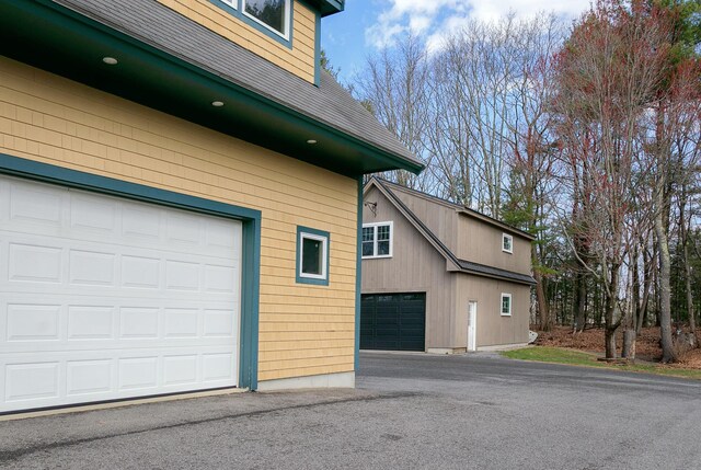 view of property exterior with a garage