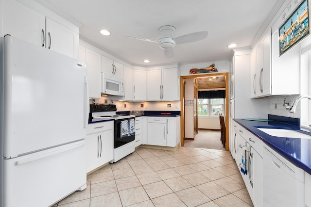 22 Gold Ribbon Dr, Wells, ME 04090 - kitchen with ceiling fan, white appliances, white cabinets, a sink, and dark countertops