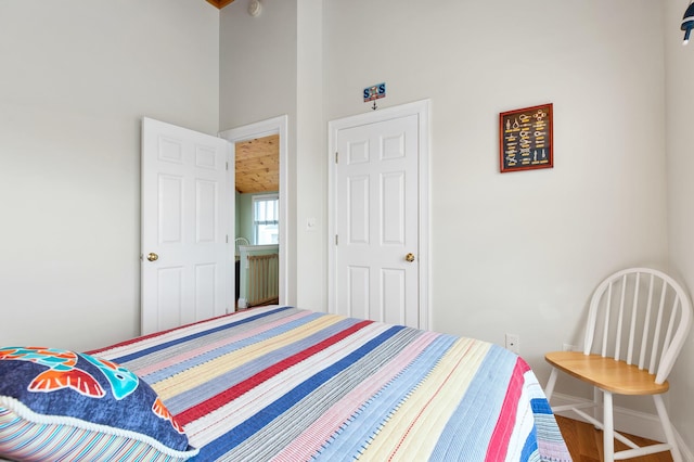22 Gold Ribbon Dr, Wells, ME 04090 - bedroom featuring a high ceiling, wood finished floors, and baseboards