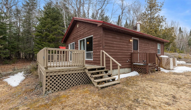 119 W Conroy Lake Rd, Monticello, ME 04760 - rear view of property with a deck and faux log siding