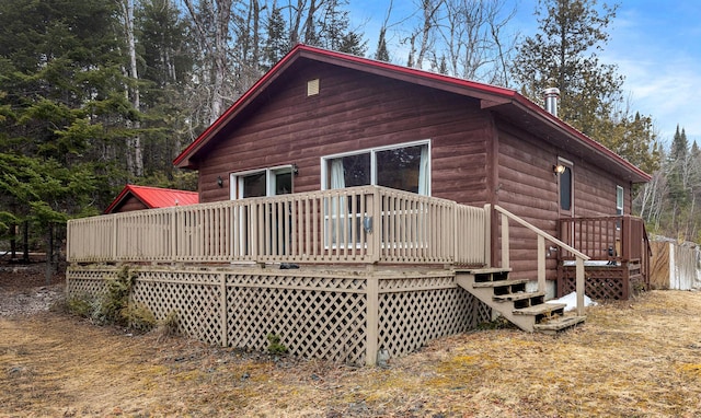119 W Conroy Lake Rd, Monticello, ME 04760 - back of property featuring a wooden deck and log veneer siding