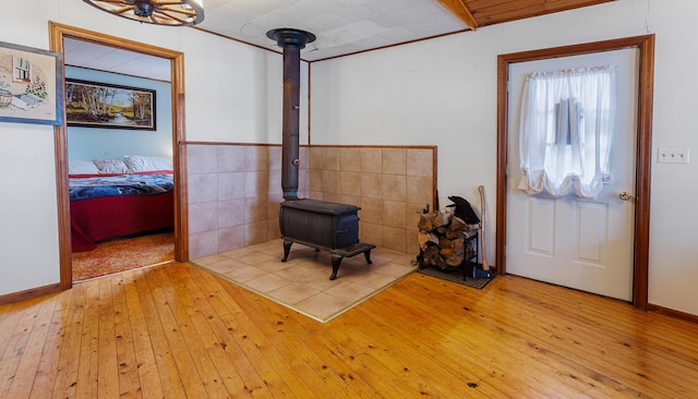 119 W Conroy Lake Rd, Monticello, ME 04760 - foyer featuring a wood stove and hardwood / wood-style floors