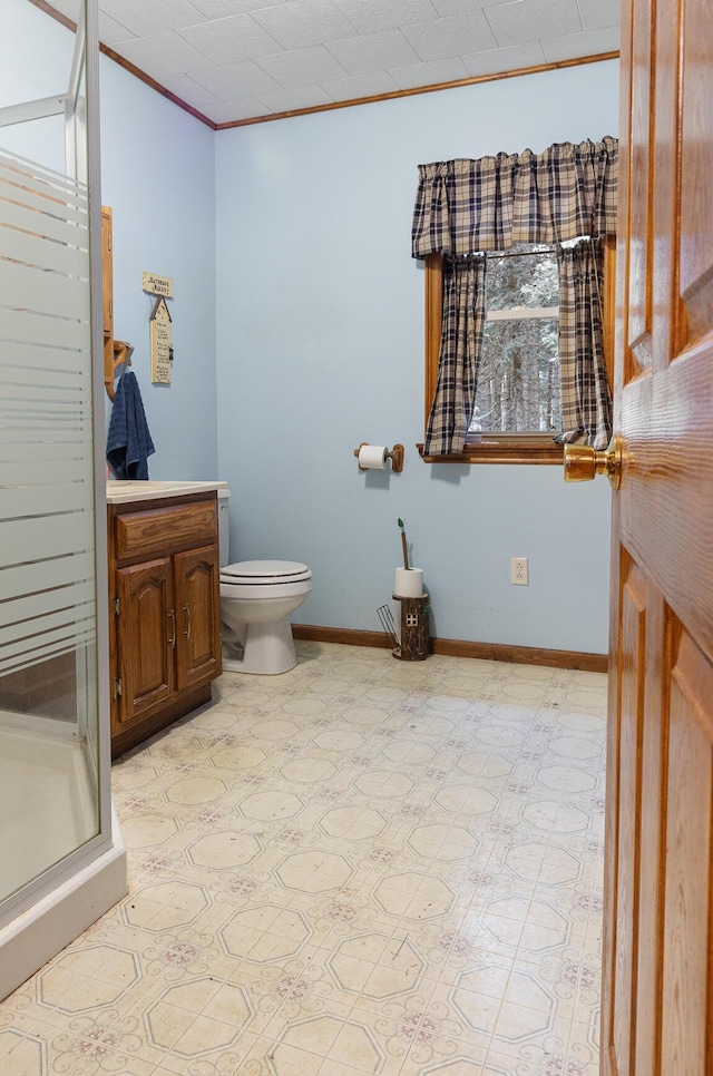 119 W Conroy Lake Rd, Monticello, ME 04760 - full bath with baseboards, ornamental molding, toilet, vanity, and a stall shower
