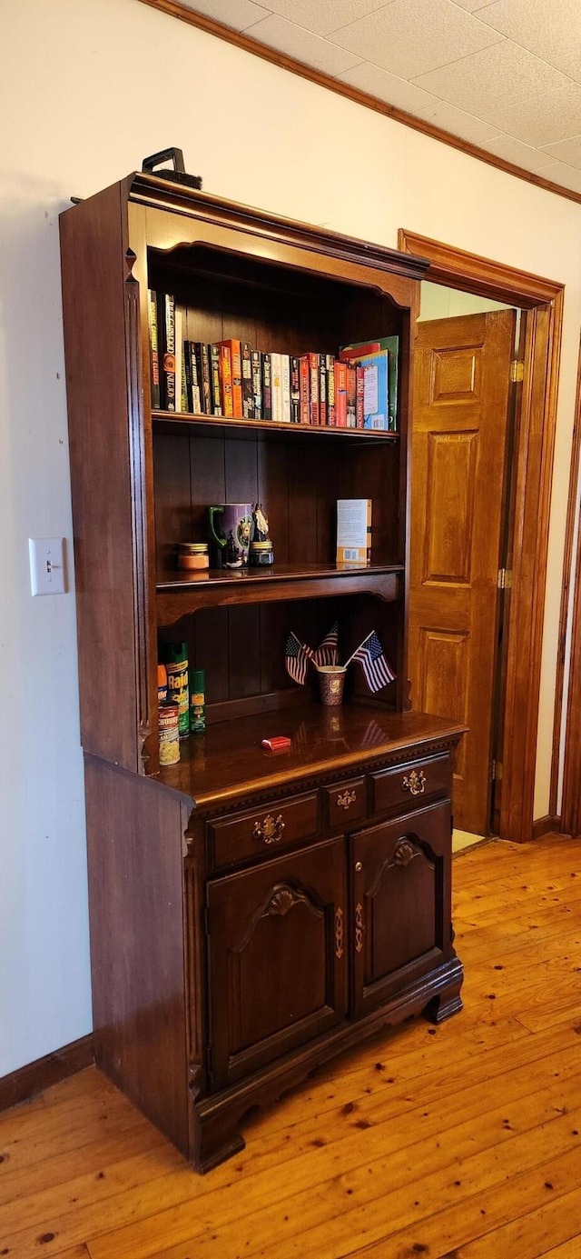 119 W Conroy Lake Rd, Monticello, ME 04760 - interior details featuring crown molding, baseboards, and wood finished floors