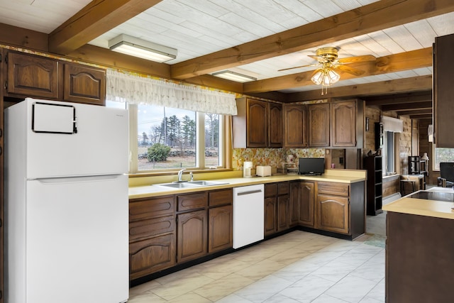 198 Hooper Rd, Shapleigh, ME 04076 - kitchen featuring white appliances, light countertops, beam ceiling, ceiling fan, and a sink