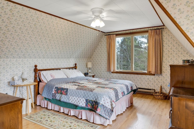 198 Hooper Rd, Shapleigh, ME 04076 - bedroom featuring baseboard heating, wallpapered walls, ornamental molding, lofted ceiling, and wood finished floors