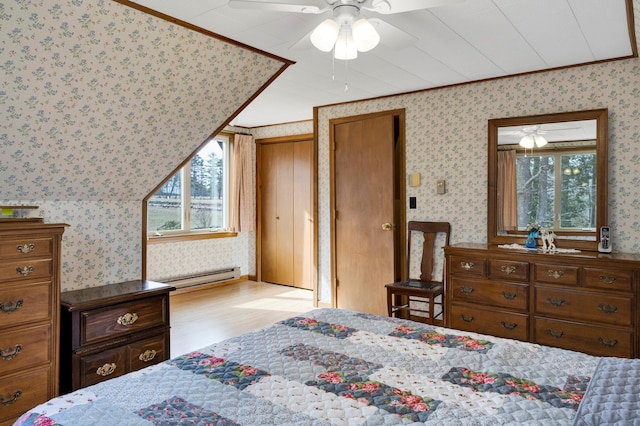 198 Hooper Rd, Shapleigh, ME 04076 - bedroom with baseboard heating, multiple windows, and wallpapered walls
