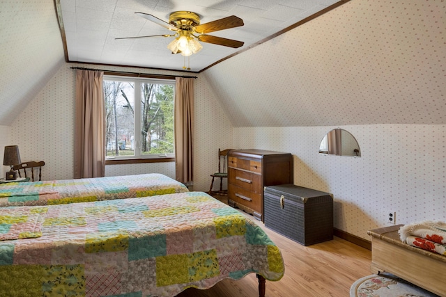198 Hooper Rd, Shapleigh, ME 04076 - bedroom with ornamental molding, wallpapered walls, a ceiling fan, lofted ceiling, and light wood finished floors