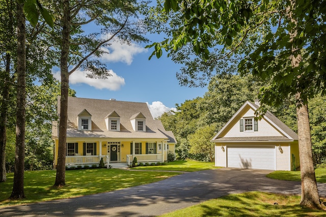 21 Bristol Dr, Rockport, ME 04856 - cape cod home featuring an outbuilding, a detached garage, a front lawn, and a porch