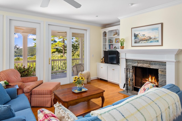 21 Bristol Dr, Rockport, ME 04856 - living room with light wood finished floors, a premium fireplace, ornamental molding, and ceiling fan
