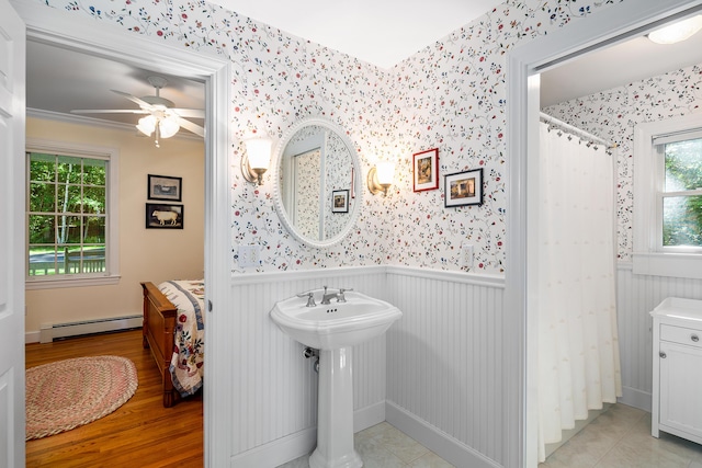 21 Bristol Dr, Rockport, ME 04856 - full bath featuring wallpapered walls, a shower with curtain, a ceiling fan, a wainscoted wall, and a baseboard radiator