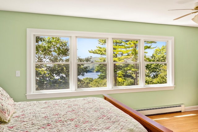 21 Bristol Dr, Rockport, ME 04856 - bedroom with a baseboard radiator and wood finished floors