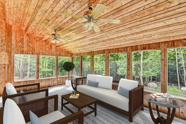 sunroom with a ceiling fan and an outdoor hangout area