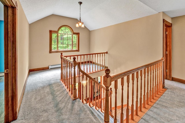 staircase with carpet floors, a baseboard radiator, vaulted ceiling, and a textured ceiling