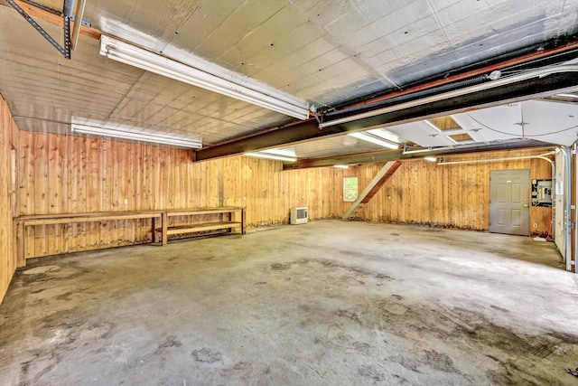 garage featuring wooden walls