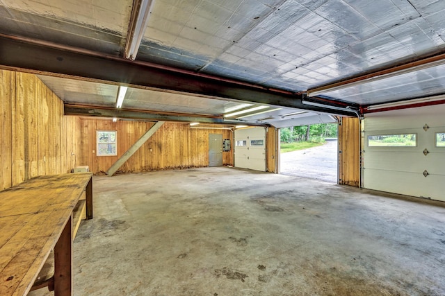 garage featuring wood walls