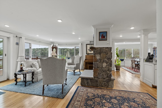 35 Barrows Rd, Boothbay Harbor, ME 04538 - living area featuring light wood-type flooring, plenty of natural light, decorative columns, ornamental molding, and recessed lighting
