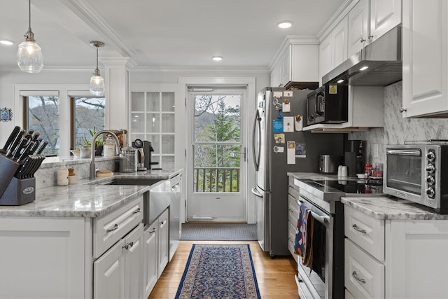 35 Barrows Rd, Boothbay Harbor, ME 04538 - kitchen featuring appliances with stainless steel finishes, white cabinetry, a sink, decorative backsplash, and ornamental molding