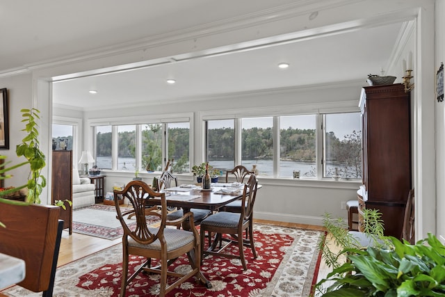 35 Barrows Rd, Boothbay Harbor, ME 04538 - dining area featuring light wood-type flooring, healthy amount of natural light, a water view, and crown molding