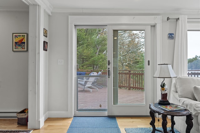 35 Barrows Rd, Boothbay Harbor, ME 04538 - doorway to outside featuring ornamental molding, light wood-type flooring, a baseboard heating unit, and baseboards