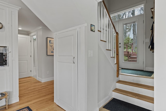35 Barrows Rd, Boothbay Harbor, ME 04538 - entryway featuring stairs, light wood-style floors, baseboards, and crown molding