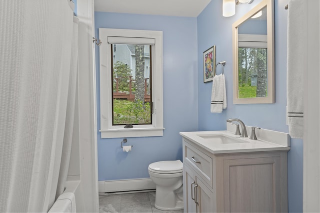 35 Barrows Rd, Boothbay Harbor, ME 04538 - bathroom with a baseboard heating unit, vanity, toilet, baseboards, and shower / tub combo