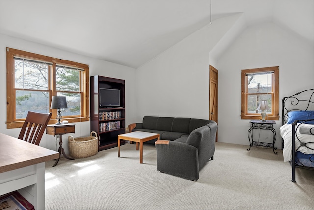 35 Barrows Rd, Boothbay Harbor, ME 04538 - living area with light colored carpet, lofted ceiling, and healthy amount of natural light