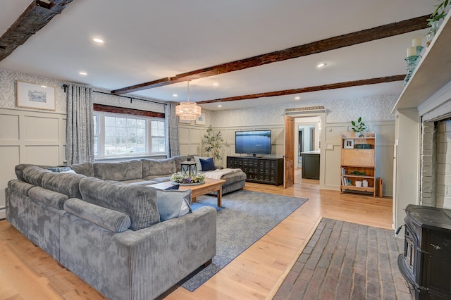 917 Main St, Fryeburg, ME 04037 - living area featuring a decorative wall, beamed ceiling, wood finished floors, and recessed lighting