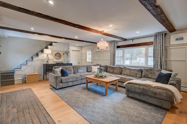 917 Main St, Fryeburg, ME 04037 - living area featuring beam ceiling, stairway, wood finished floors, a decorative wall, and recessed lighting
