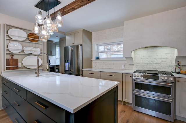917 Main St, Fryeburg, ME 04037 - kitchen with appliances with stainless steel finishes, a sink, backsplash, light stone countertops, and light wood-style flooring