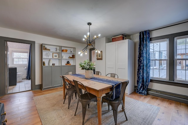 917 Main St, Fryeburg, ME 04037 - dining space featuring a chandelier, plenty of natural light, and light wood-style flooring