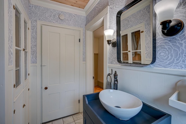 917 Main St, Fryeburg, ME 04037 - bathroom with wallpapered walls, a wainscoted wall, ornamental molding, and vanity