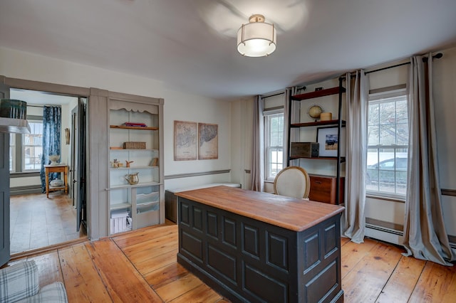 917 Main St, Fryeburg, ME 04037 - home office with light wood finished floors, plenty of natural light, and a baseboard radiator